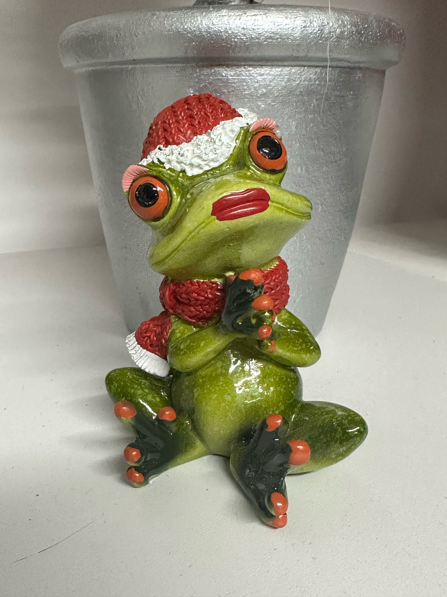 Christmas Frog clutching hands